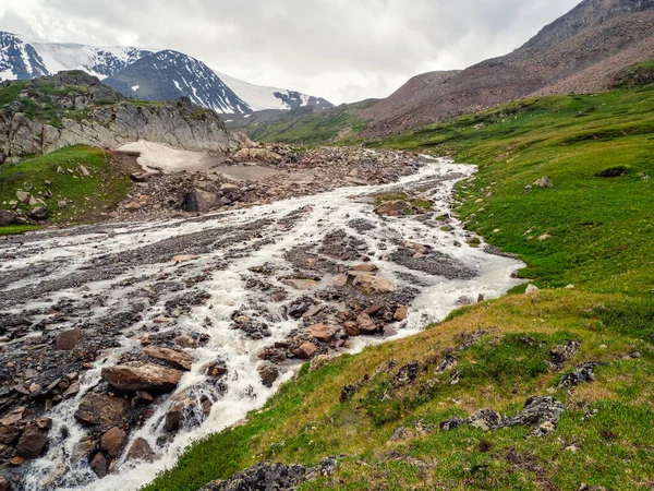 The bed of the mountain river became shallow after the flow of melt water, the dry season in the mountains.