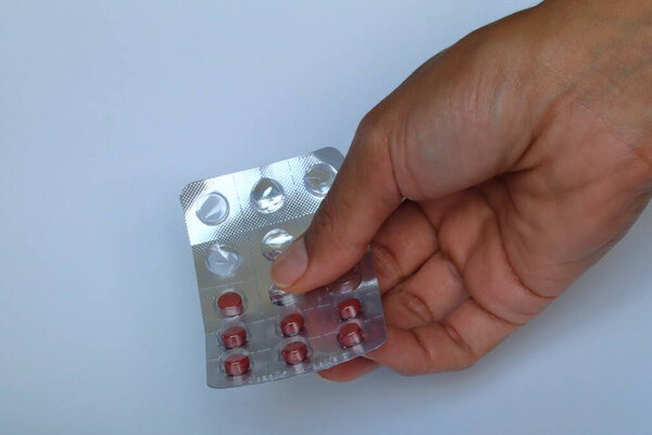 pills in blister pack on a white background
