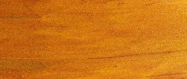 Yağlı boya darbelerinin bronz altın arkaplanı. Kahverengi-turuncu boya darbelerinin ışıltılı yüzeyi. Parıltılı koyu altın rengi boya.