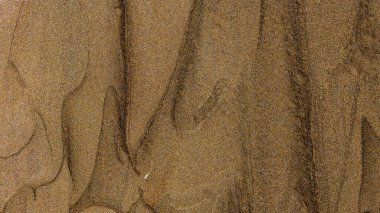 Kahverengi toprak renginin ışıltılı dokusu. Doğal kahverengi parlak yüzey. Işıltılı boya darbelerinin soyut arkaplanı. Toprak rengi kavramı