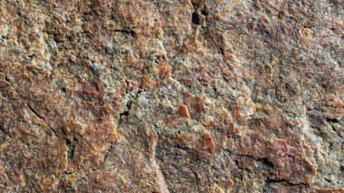Çatlak granit taş dokusu. Granit kaya yüzeyi. Doğal taş zemin. Boşluğu kopyala