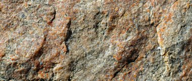 Çatlak granit taş dokusu. Granit kaya yüzeyi. Doğal taş zemin. Boşluğu kopyala