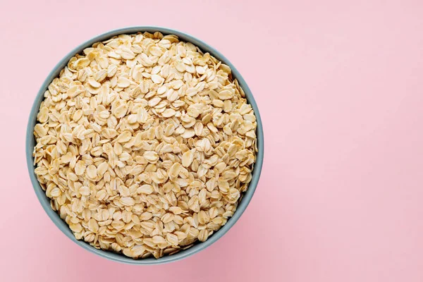 Oat Flakes Bowl Pink Background Dry Rolled Oatmeal Gray Bowl — Stock Photo, Image