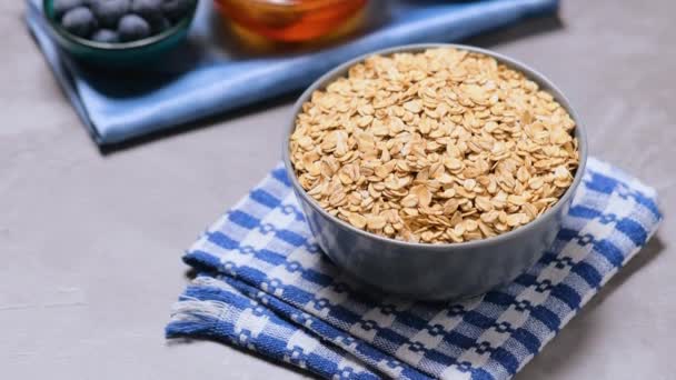 Oatmeal Bowl Dry Oatmeal Blueberries Nuts Honey Ingredients Healthy Breakfast — Stock Video