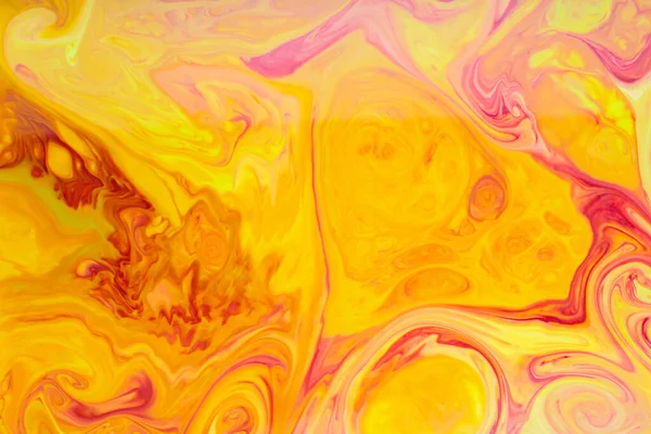 Fluid Art. Abstract liquid orange-red colors paint background. Trendy golden orange backdrop. Liquid art concept