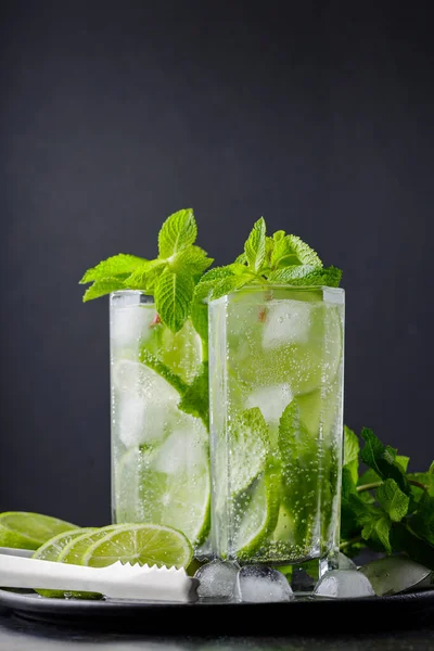 Two Glasses Mojito Cocktail Lime Slices Mint Ice Dark Background — ストック写真