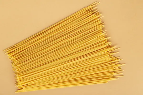 Dry Spaghetti Pasta Beige Background Yellow Italian Pasta Close Top — Stock Photo, Image