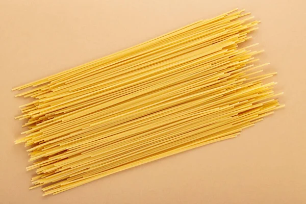 Dry Spaghetti Pasta Beige Background Yellow Italian Pasta Close Top — Stock Photo, Image