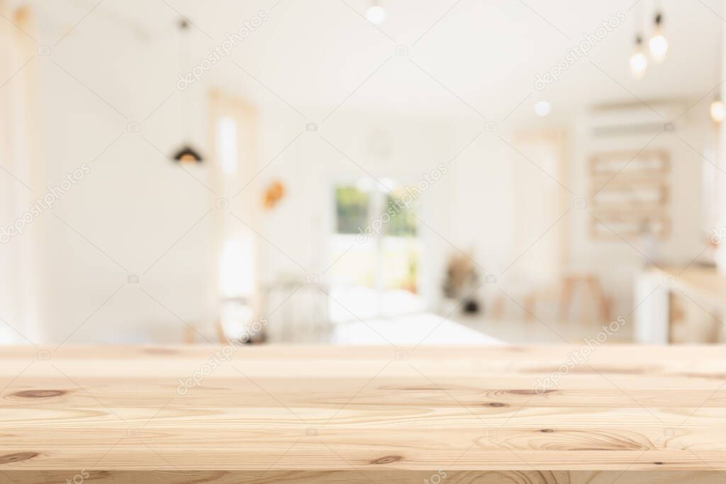 Empty wood table with blur coffee shop background clean bright light foreground Mock up for montage products display