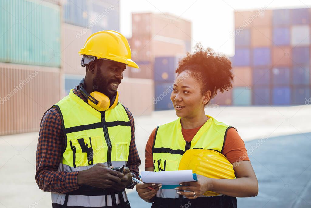 African man and women happy working talking together in cargo logistic port