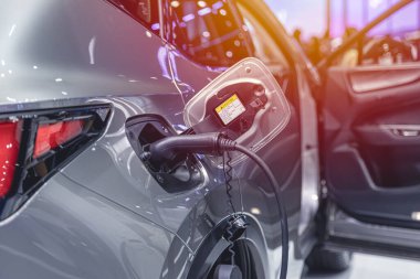 EV Car at charging station, Electric car green energy and eco power concept.