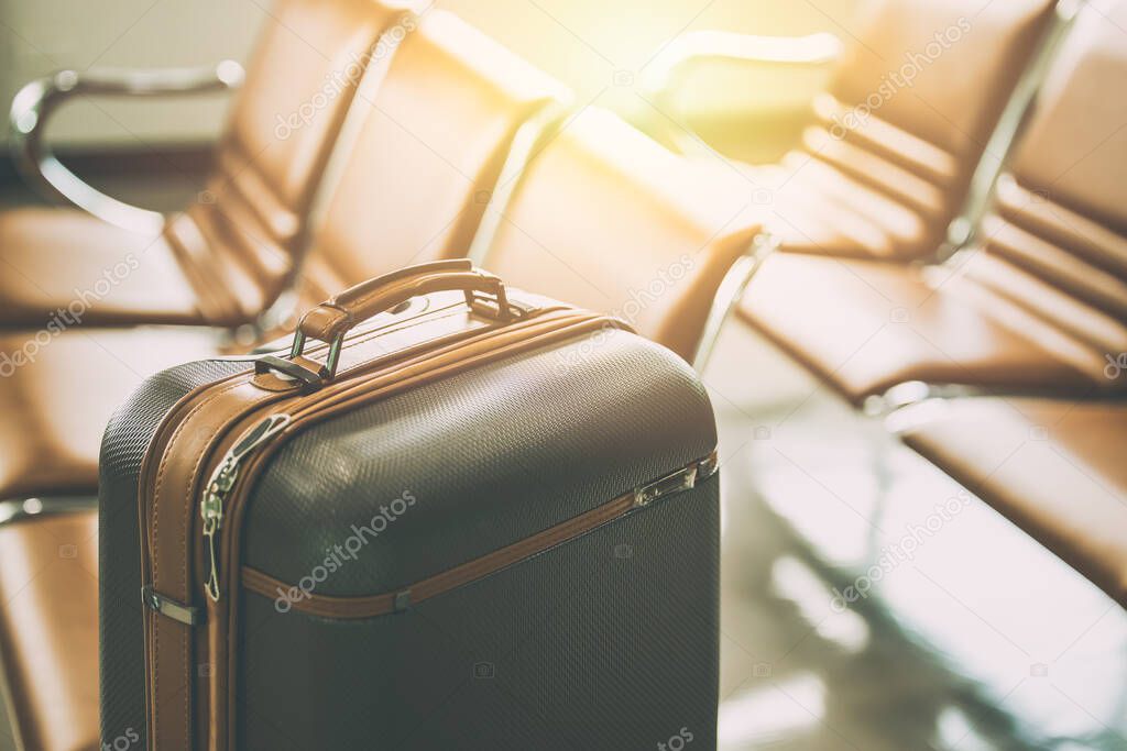 travel luggage bag in airport at waiting area for holiday vacation traveller visitor flight concept