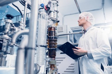 Science lab medical factory staff working for Cannabis CBD oil extraction. Hemp oil extraction Thin Film Distillation Laboratory Plants Process.