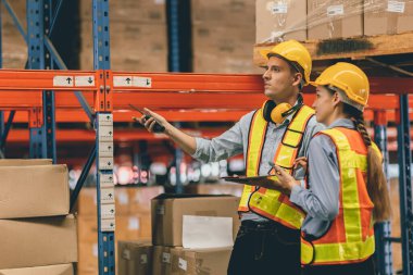 cargo warehouse working people caucasian male and woman working together engineer teamwork