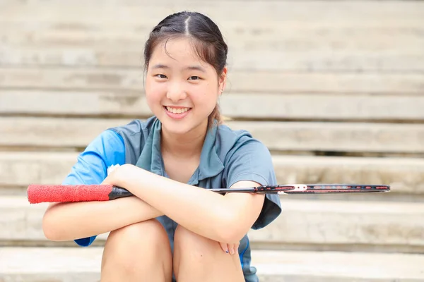 Badminton sport player portrait Asian teen athlete happy smile