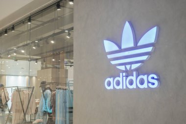 Adidas Brand logo at front of official store in shopping mall, German largest sportswear manufacturer in Europe since 1949.13 March 2022.Bangkok.THAILAND.