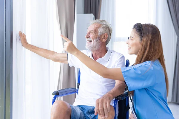 Nurse Medical Team Staff Working Support Service Health Care Senior Elderly Man on Wheel Chair in Home Care.