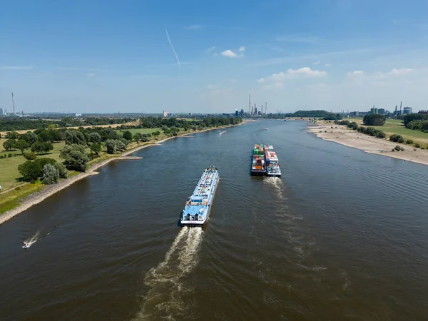 Barges on the Rhine river transporting goods.