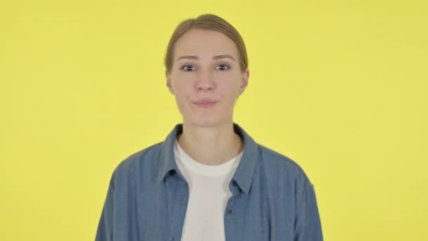 Young Woman showing No Sign by Shaking Head on Yellow Background — Stock Video