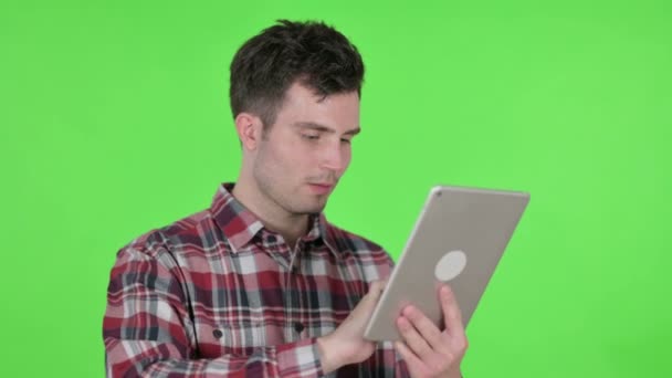 Portrait of Young Man using Digital Tablet, Green Chroma Screen — Stok Video