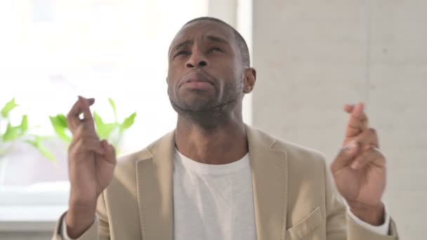 Portrait of African Man Praying with Fingers Crossed — Vídeo de Stock