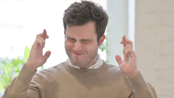 Portrait of Man Praying with Fingers Crossed — Stock Photo, Image