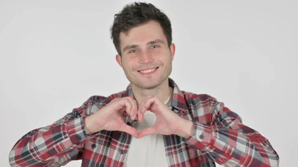 Retrato de un joven mostrando la forma del corazón con las manos —  Fotos de Stock