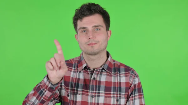 Portrait of Young Man showing No Sign by Finger, Green Chroma Screen — 스톡 사진