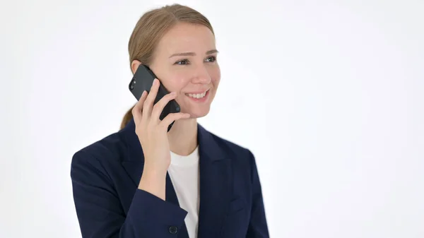 Jovem empresária conversando no telefone em fundo branco — Fotografia de Stock