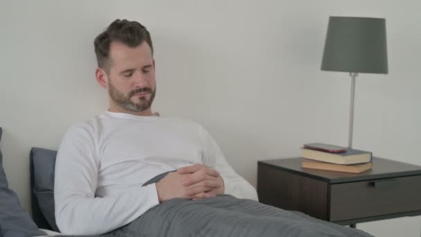 Man Taking Nap while Sitting in Bed — Stock Video