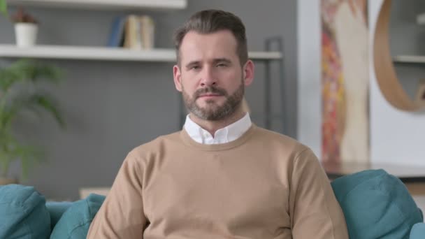 Portrait of Man showing Thumbs Down at Home — Stock Video