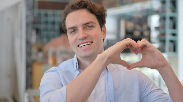 Portrait of Creative Man showing Heart Sign by Hand —  Fotos de Stock