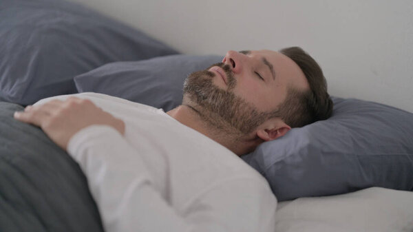 Man Sleeping in Bed Peacefully