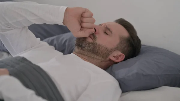 Man Coughing while Sleeping in Bed — Stock Photo, Image