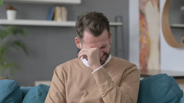 Portrait of Man Crying while Sitting on Sofa — Stock Photo, Image