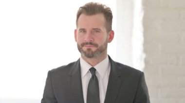 Middle Aged Businessman Showing No Sign by Finger, Denial 