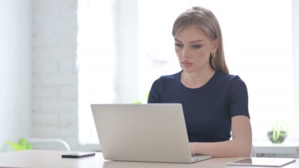 Young Woman Having Neck Pain While Using Laptop — Stock Video