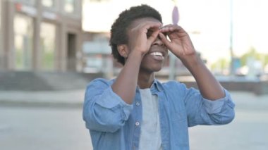 Outdoor Man Searching with Handmade Binocular 
