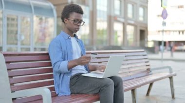 African Man Having Online Payment Problem via Smartphone, Outdoor