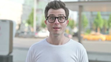 Portrait of Agree Casual Man Shaking Head in Approval Outdoor