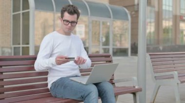 Excited Casual Man Shopping Online with Laptop, Outdoor