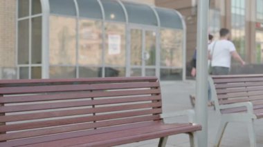 Casual Man Coming, Sitting on Bench and Opening Laptop