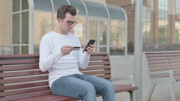 Excited Casual Man Shopping Online Smartphone While Sitting Outdoor Bench — Stockvideo