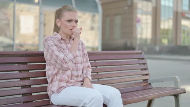 Casual Woman Coughing While Sitting Bench Outdoor — Vídeos de Stock