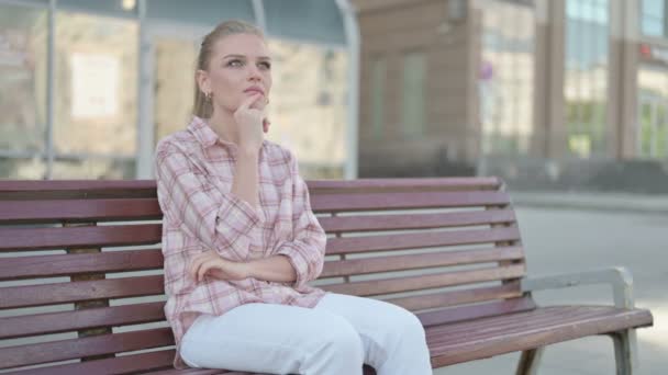 Pensive Casual Woman Thinking While Sitting Outdoor Bench — Stock videók