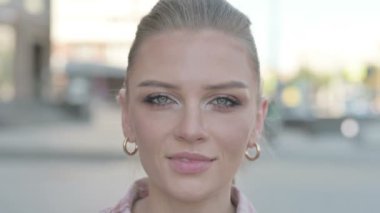 Face Close up of Smiling Young Woman Outdoor