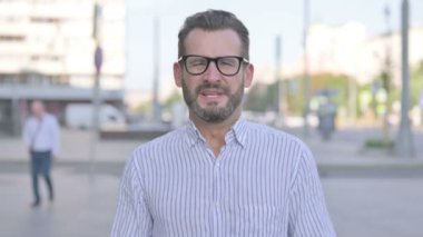 Angry Adult Man Screaming in Frustration Outdoor