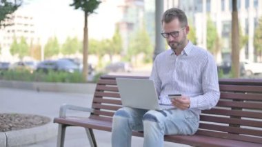 Adult Man making Online Payment Failure on Laptop in Office 