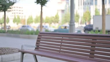 Adult Man Coming and Sitting on Bench Outdoor
