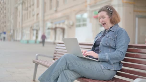 Senior Old Woman Celebrating Success Laptop While Sitting Outdoor Bench — Video